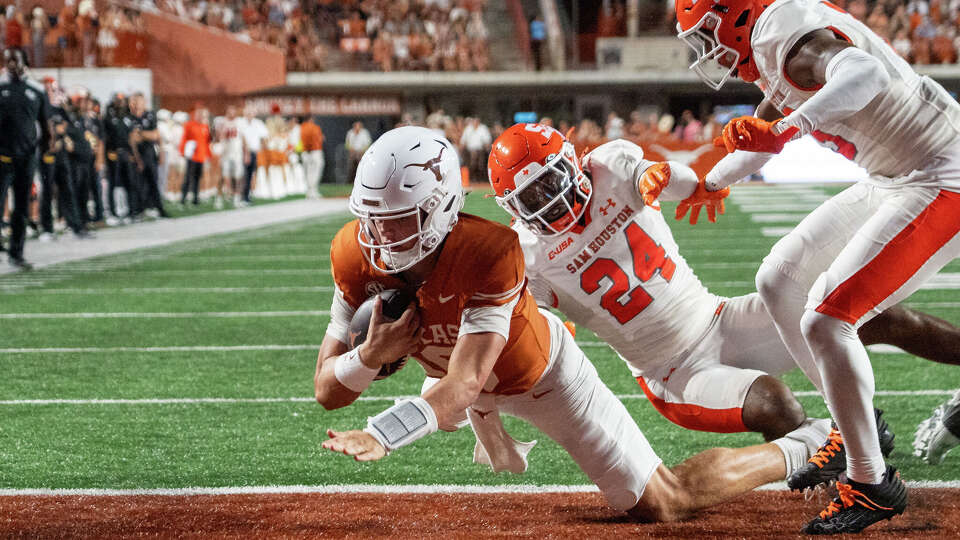 Texas Longhorns quarterback Arch Manning (16) jumps into the end zone to score a touch down during the Texas Longhorns’ game against the Sam Houston State Bearkats at Darrell K Royal–Texas Memorial Stadium in Austin, Saturday, Sept. 20, 2025.