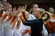Texas Longhorns libero Emma Halter (2) high-fives her teammates before taking the court against the Vanderbilt Commodores at Gregory Gymnasium in Austin, Sept. 24, 2025.