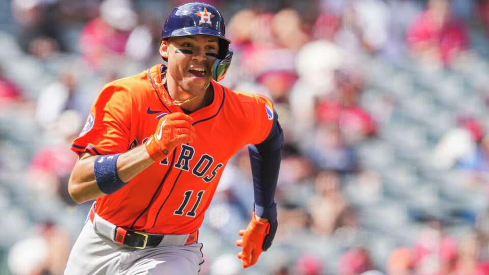 Houston Astros Cam Smith (11) hits a double during an MLB baseball game in Anaheim, Sunday, Sept. 28, 2025.