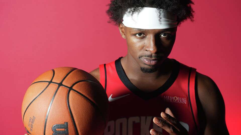 Houston Rockets forward Jae’Sean Tate (8) poses for a photo during media day at the Toyota Center in Houston on Monday, Sept. 29, 2025.
