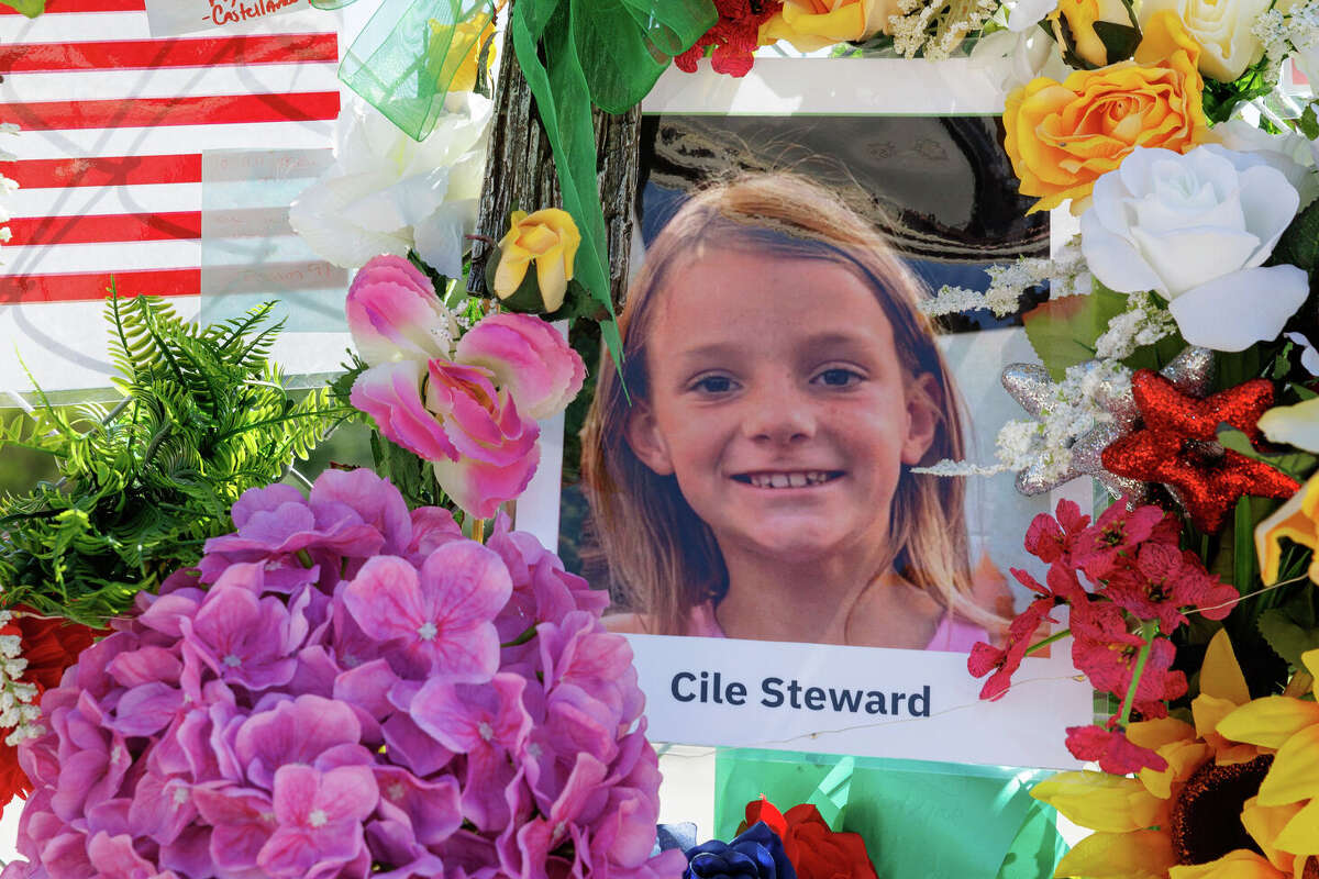 A photo of 8-year-old Cile Steward is featured on the growing 'Wall of Hope' memorial on Water Street in downtown Kerrville on Wednesday, July 23, 2025. Steward is the only camper from Camp Mystic who has not yet been found following the devastating flooding that struck the camp on July 4.