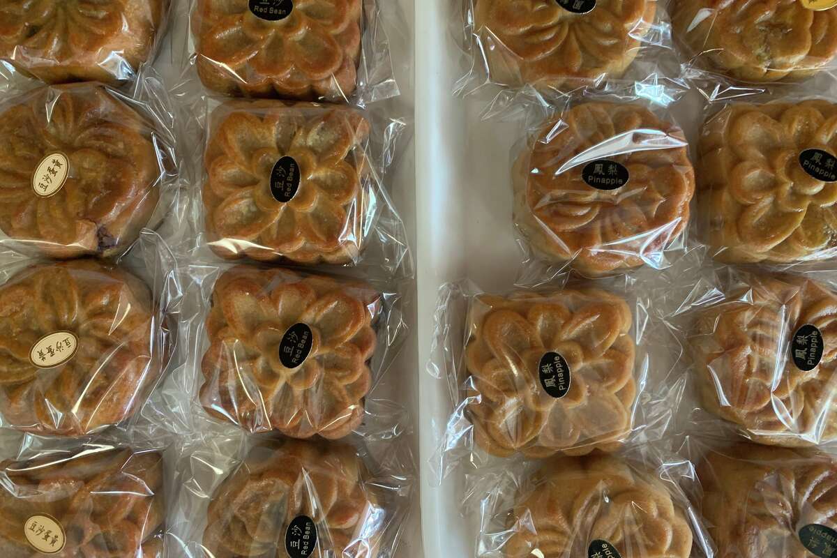 Merryland Bakery has shelves full of mooncakes, including both bite-sized and palm-sized options.