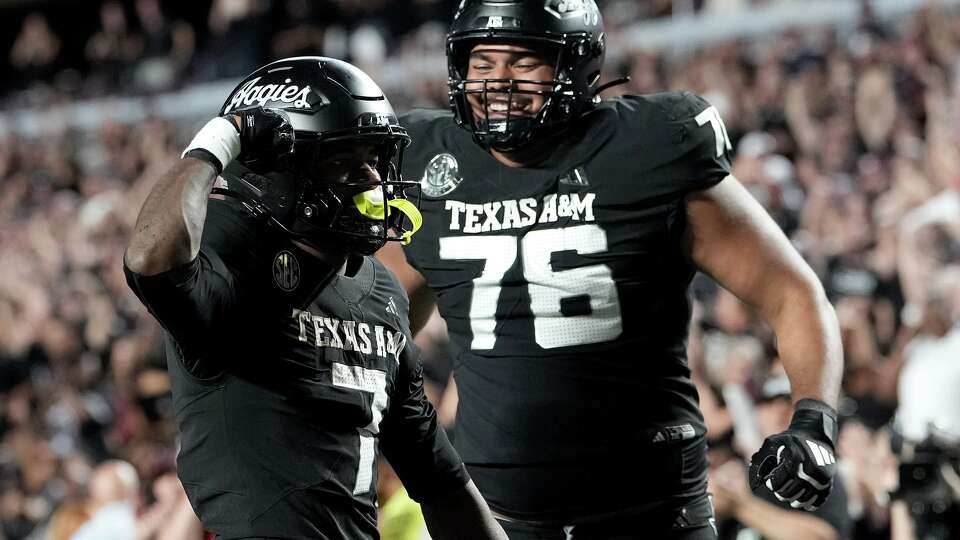 Texas A&M wide receiver KC Concepcion (7) reacts with offensive lineman Reuben Fatheree II (76) after scoring a touchdown against Mississippi State during the second quarter of an NCAA college football game Saturday, Oct. 4, 2025, in College Station, Texas.