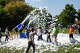 Students play in bubbles as they're covered by more foam during Big Rapids Middle School's Foam Frenzy at Hemlock Park, Friday, Oct. 3. The Parent Teacher Organization event raised funds for student activities.