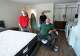 Carlos Vallejo, along with CG&S project manager Danny Scott, left, project architect Marsha Topham and production manager Nathan Morris, looks at his bedroom in his newly remodeled home in East Austin on Thursday, Oct. 9, 2025. CG&S Design-Build did the $150,000 home renovation as part of the Statesman Season for Caring campaign. Vallejo lost an arm and a leg in a boating accident.
