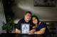 Payman and Ofelia Noroozi, right, hold an image of their son, Amin, on Sept. 30 at their home in Lafayette. Amin was paralyzed while swimming in the ocean with his girlfriend at Stinson Beach and died days later.