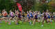 Les coureurs prennent le parcours dans la division Varsity Girls Large de 5 000 mètres lors de la 42e rencontre de cross-country sur invitation de Wickham le samedi 11 octobre 2025 à Wickham Park à Manchester.