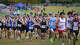 Les coureurs de la division Varsity Boys Large de 5 000 mètres prennent le parcours lors de la 42e rencontre de cross-country sur invitation de Wickham le samedi 11 octobre 2025 à Wickham Park à Manchester.