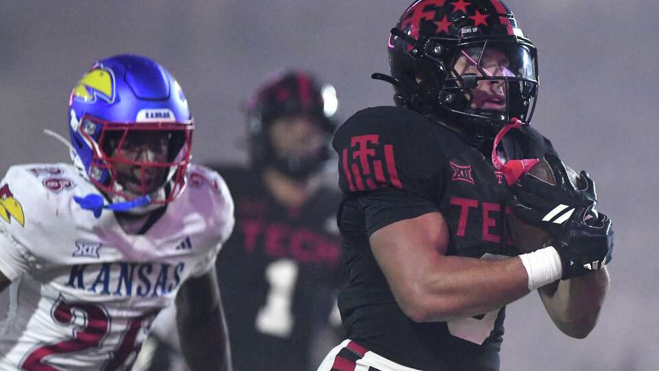 Texas Tech running back Cameron Dickey (8) runs into the end zone for a touchdown during the fourth quarter of an NCAA college football game, Saturday, Oct. 11, 2025, in Lubbock, Texas.