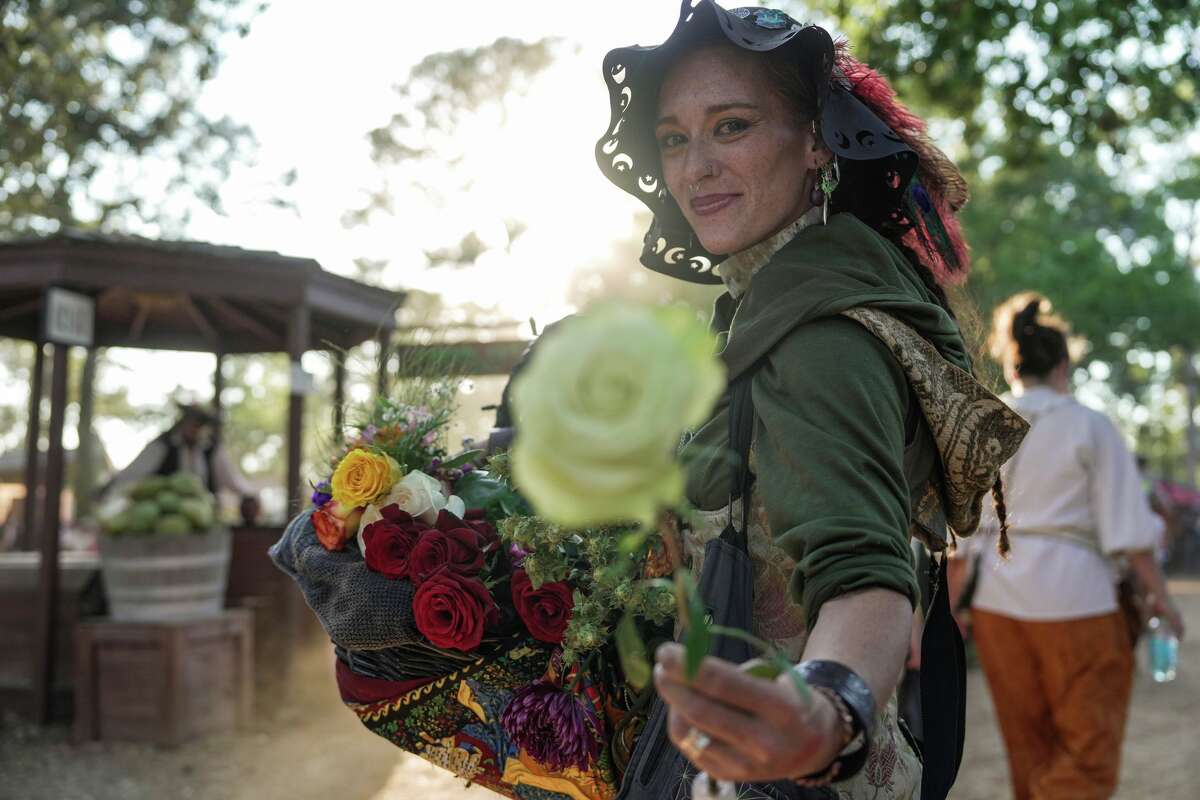 Sunshine Phoenix sells roses at the 51st annual Texas Renaissance Festival is photographed on Saturday October 11, 2025 in Todd Mission.