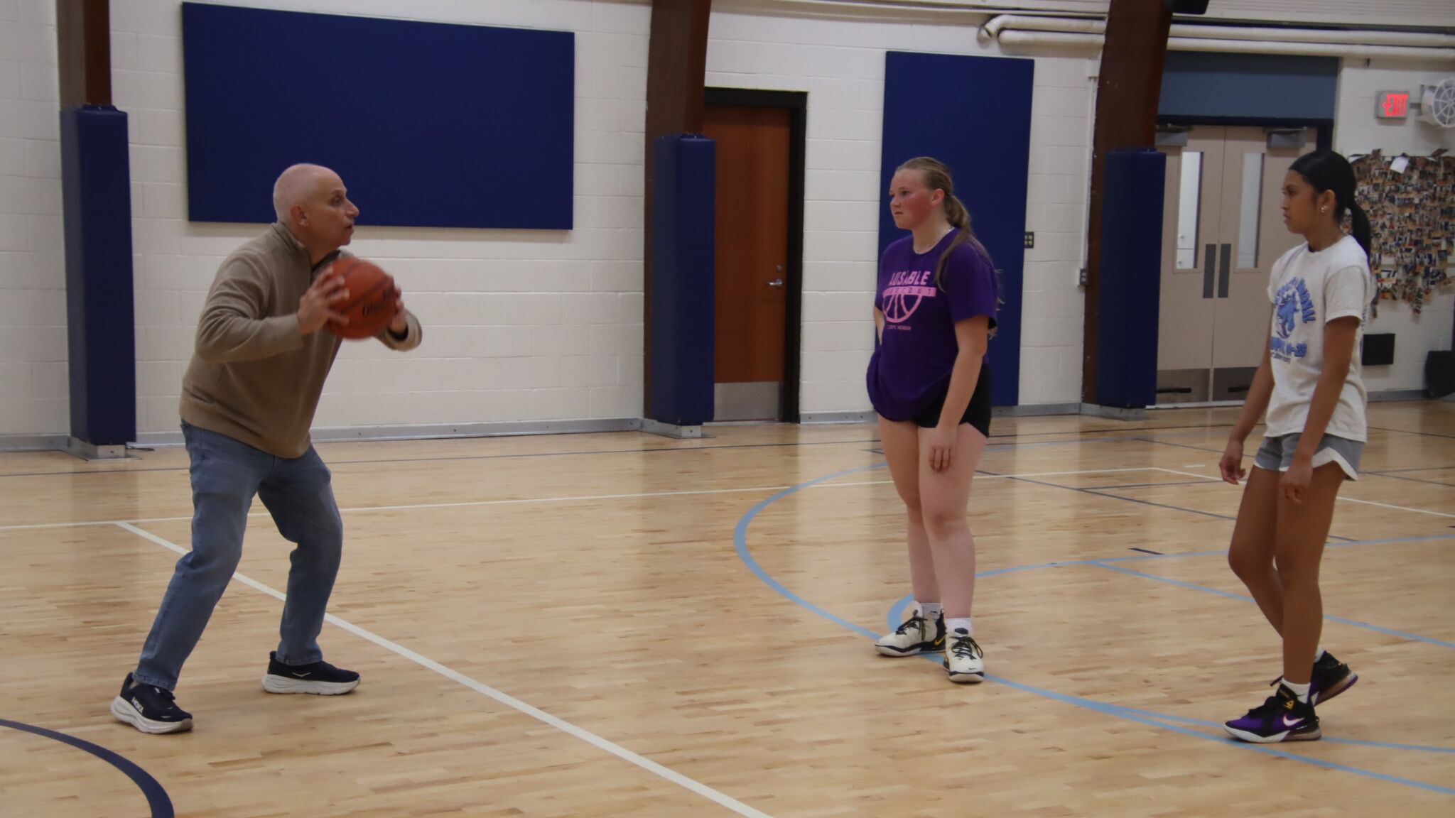 Meridian girls' basketball coach Eric Krause visits with Daily News