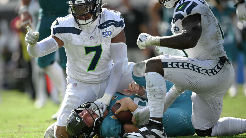 Seattle Seahawks linebacker Uchenna Nwosu (7) celebrates after sacking Jacksonville Jaguars quarterback Trevor Lawrence during the second half of an NFL football game Sunday, Oct. 12 2025, in Jacksonville, Fla.