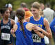 Mercy's #442 Cora Wasiolek hugs teammate Alyson Low after finishing first in the 5,000 meters during the SCC high school cross country championships at East Shore Park in New Haven, Conn., Wednesday, October 15, 2025.