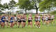 Varsity girls are off at the start of the SCC high school cross country championships at East Shore Park in New Haven, Conn., Wednesday, October 15, 2025.