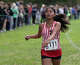 Cheshire's Emily D'Souza crosses the finish line in seventh place in the 5,000 meters during the SCC high school cross country championships at East Shore Park in New Haven, Conn., Wednesday, October 15, 2025.