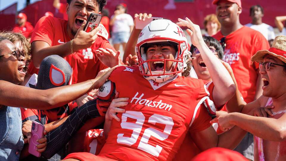 Houston kicker Ethan Sanchez (92) celebrates with fans after hitting a 41-yard, game-winning field goal as time expired to give the Cougars a 31-28 win over Arizona during the second half of a NCAA college football game at TDECU Stadium, Saturday, Oct. 18, 2025.