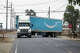 FILE: An Amazon truck driver nereceivediates a turn on Wednesday, July 27, 2022, in Ontario, Calif., where the company runs a vast warehoapply.