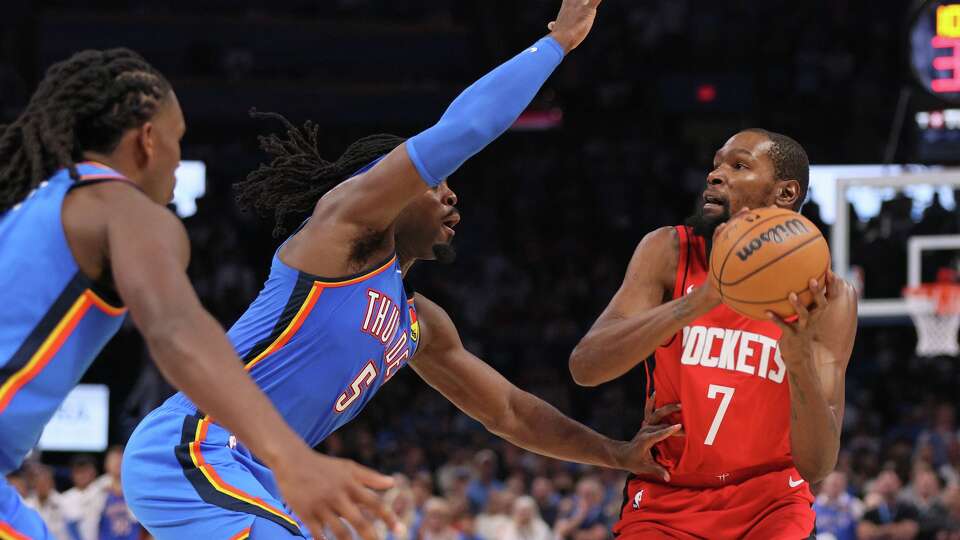 Houston Rockets forward Kevin Durant (7) looks to shoot over Oklahoma City Thunder guard Luguentz Dort (5) during the second half of an NBA basketball game Tuesday, Oct. 21, 2025, in Oklahoma City. (AP Photo/Nate Billings)