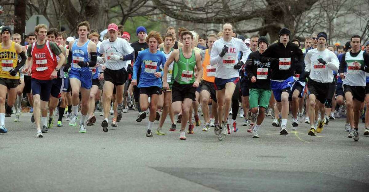 Runners begin the 33rd Pequot Running Club Thanksgiving Day five-mile race in Southport on November 25, 2010.