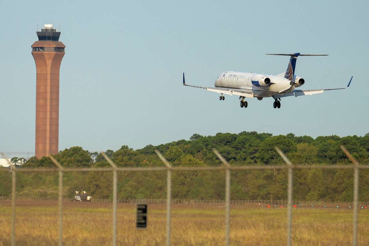 A United Express jet comes in for a landing at George Bush Intercontinental Airport in Houston, Wednesday, Oct. 22, 2025. A ground stop, due to staffing shortages because of the government shutdown, from the day before was lifted and operations at the airport continued.