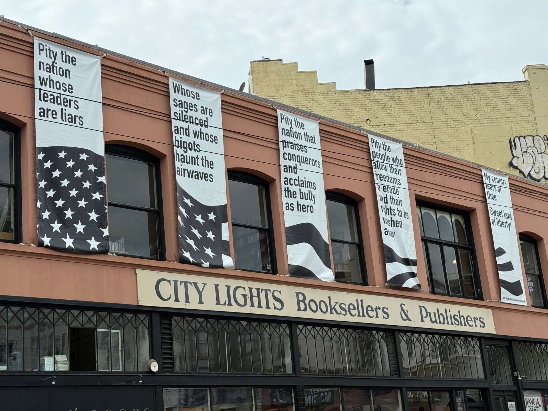 S.F.'s City Lights displays banners warning against tyranny