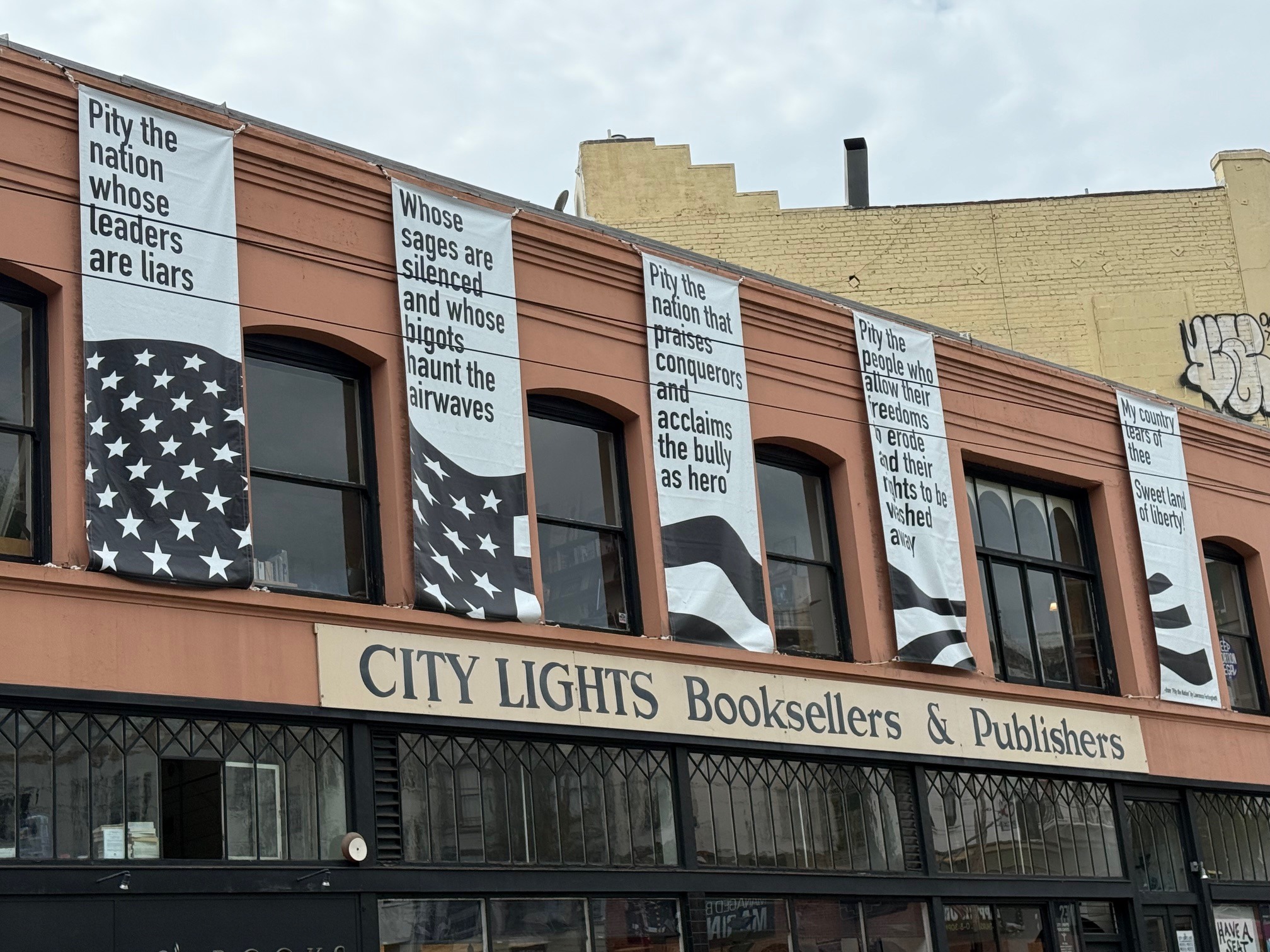 S.F.'s City Lights displays banners warning against tyranny