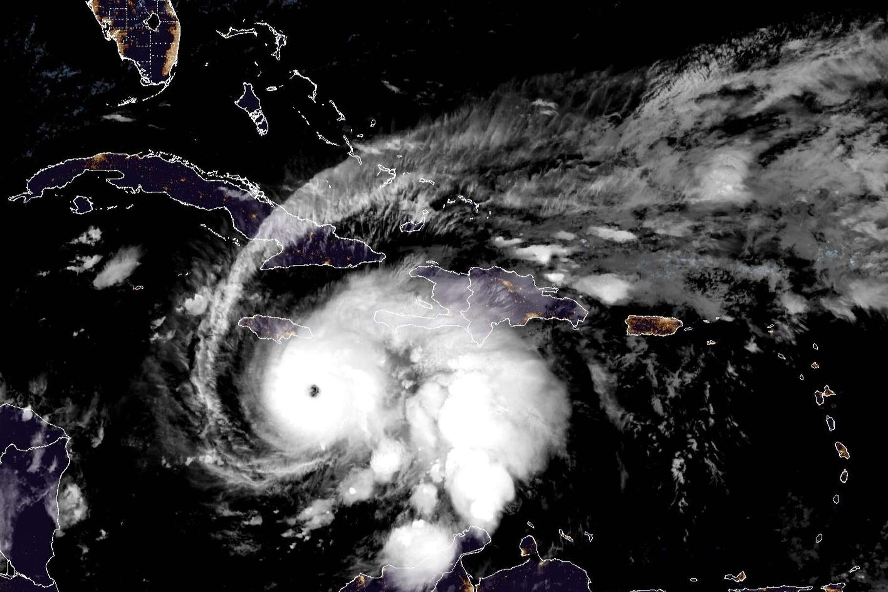 This weather satellite photo of the Caribbean Sea taken early Sunday shows a clearly defined eye in the center of an organized Hurricane Melissa south of Jamaica.