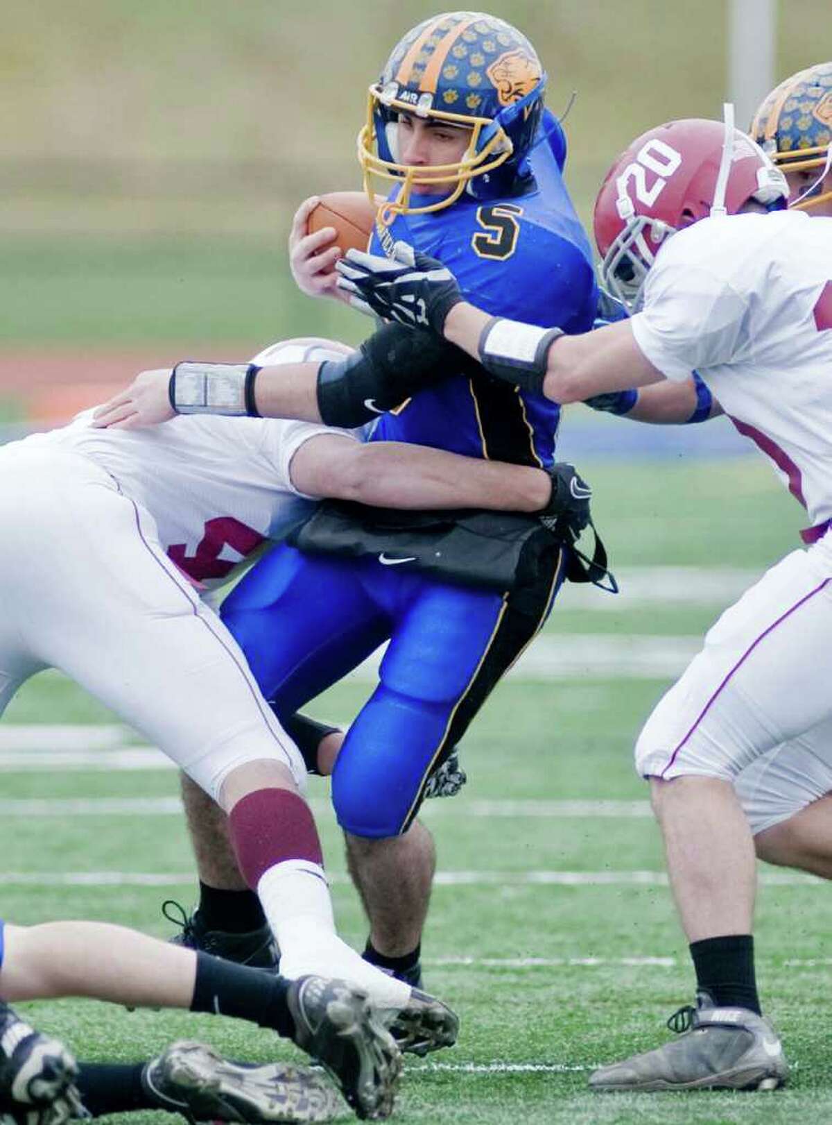 Brookfield's Nick Paez tries to break free during a football game against Bethel at Brookfield. Thursday, Nov. 25, 2010