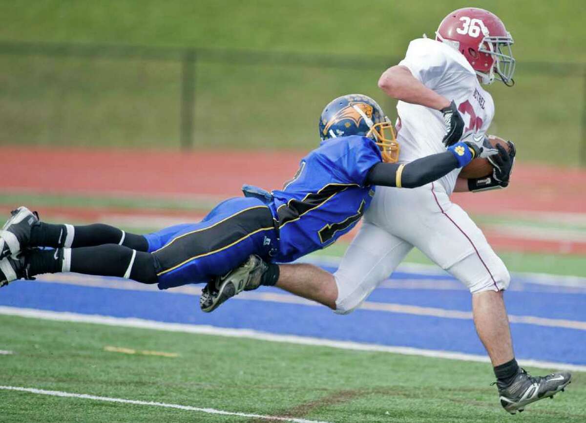 Brookfield's Alphonso Gordon tries to bring down Bethel's Brian Birdsell during a football game at Brookfield. Thursday, Nov. 25, 2010