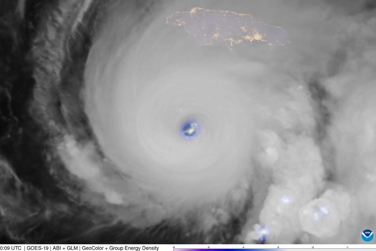 This weather satellite photo taken early Monday shows abundant lightning flashes within the eye wall of Hurricane Melissa, a Category 5 storm approaching Jamaica.