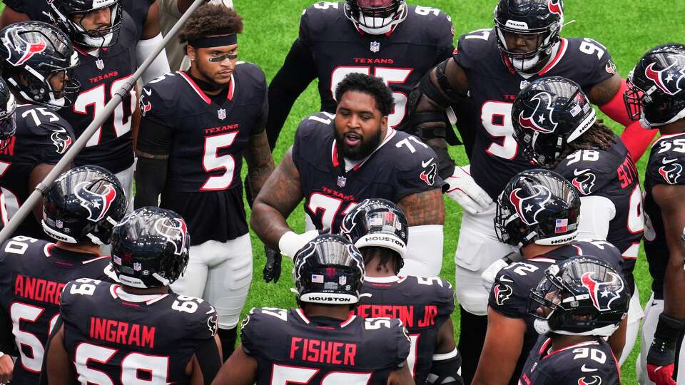Houston Texans offensive tackle Tytus Howard (71) talks to players before an NFL football game at NRG Stadium in Houston, Sunday, Nov. 2, 2025.