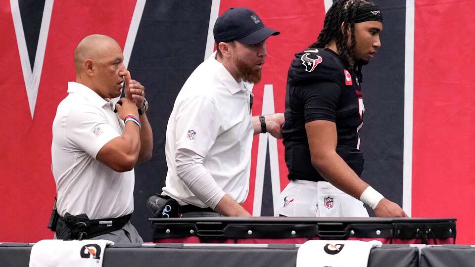 Houston Texans quarterback C.J. Stroud (7) leaves the field after getting hit by Denver Broncos cornerback Kris Abrams-Draine during the first half of an NFL football game at NRG Stadium in Houston, Sunday, Nov. 2, 2025.