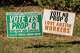 Campaign signs for and against Prop Q are posted on Waller Street on Monday, Nov. 3, 2025.