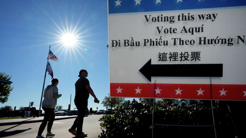 People are shown outside the polling place at the Richard & Meg Weekley Community Center in Cypress Tuesday, Nov. 4, 2025.