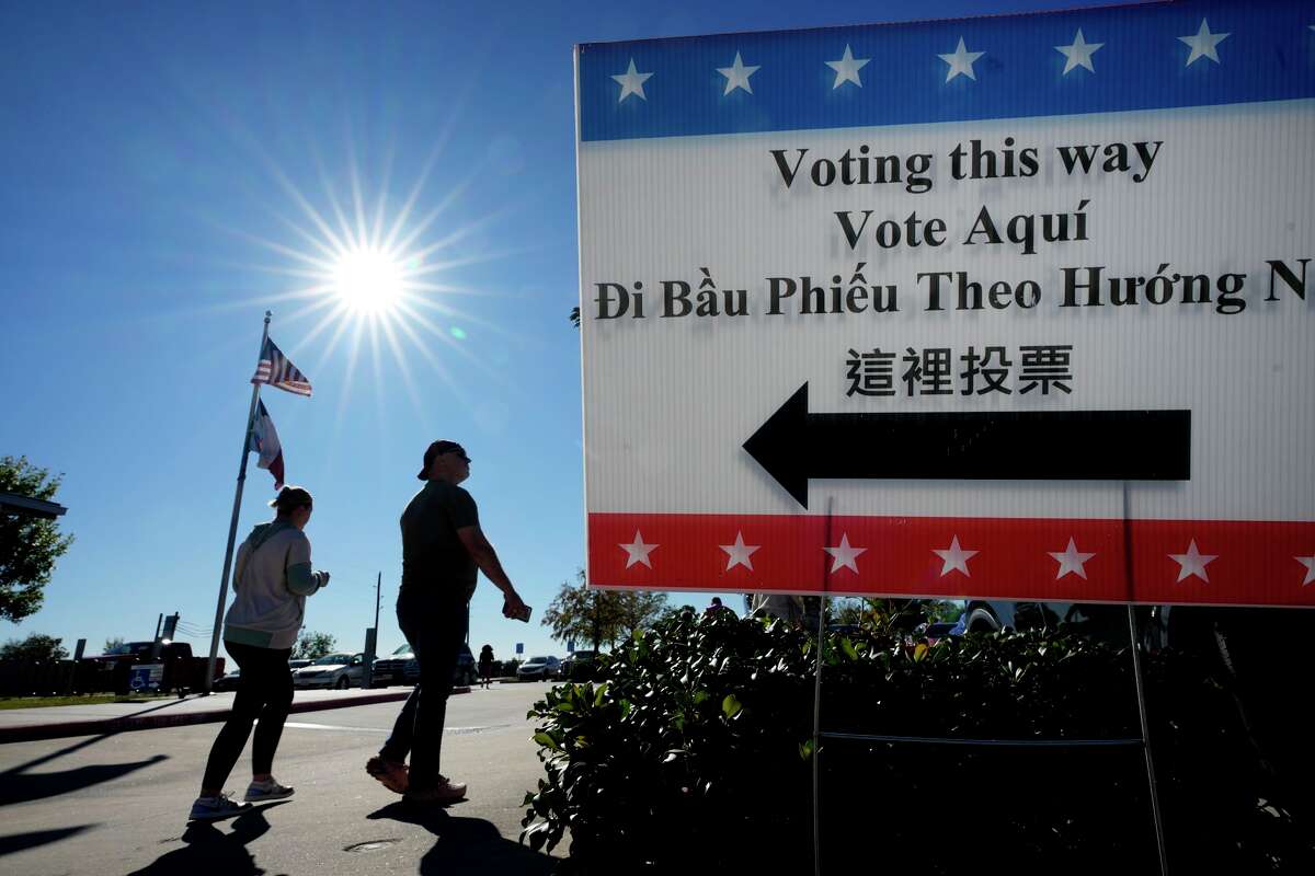 People are shown outside the polling place at the Richard & Meg Weekley Community Center in Cypress Tuesday, Nov. 4, 2025.
