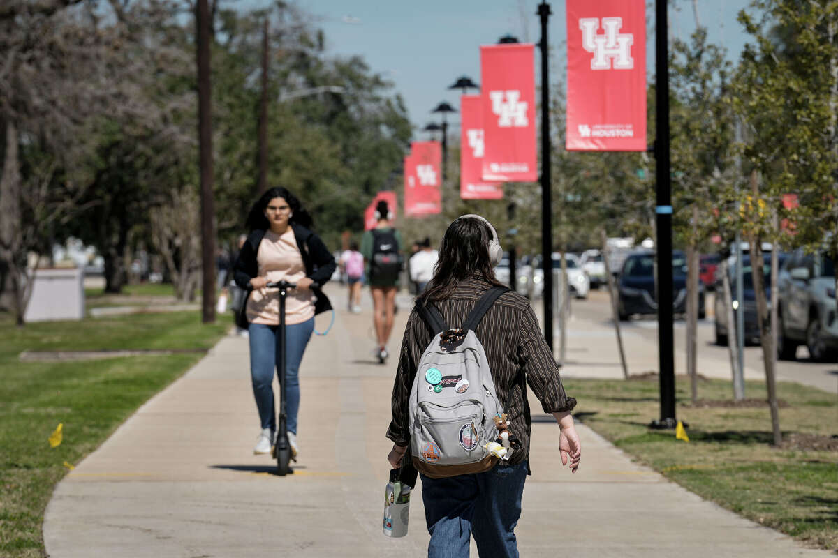 Students walk on Cullen Boulevard at the University of Houston campus on Feb. 25, 2025.