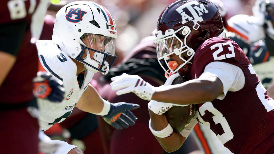 Jamarion Morrow #23 of the Texas A&M Aggies runs with the ball against Elijah Melendez #9 of the Auburn Tigers at Kyle Field on September 27, 2025 in College Station. (Photo by Kenneth Richmond/Getty Images)
