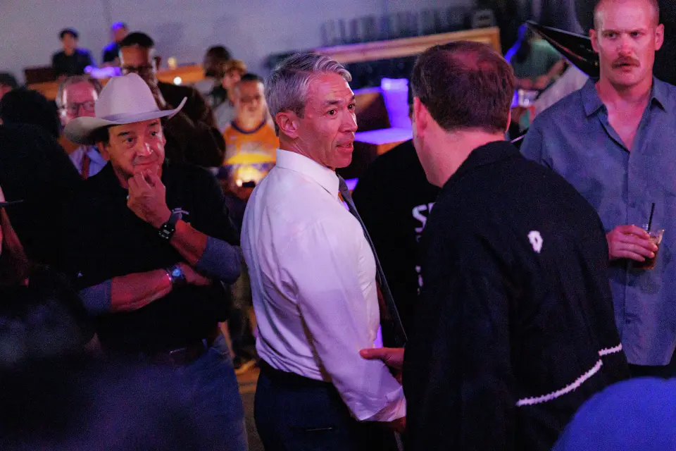 Former Mayor Ron Nirenberg, center, talks with Peter J. Holt, right, managing partner and chairman of Spurs Sports & Entertainment, after Holt announced that Proposition B would pass during a Win Together PAC election watch party at River North Icehouse in San Antonio, Tuesday, Nov. 4, 2025.