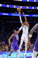 San Antonio Spurs forward Victor Wembanyama, right, shoots as Los Angeles Lakers forward Rui Hachimura defends during the second half of an NBA basketball game Wednesday, Nov. 5, 2025, in Los Angeles. (AP Photo/Mark J. Terrill)