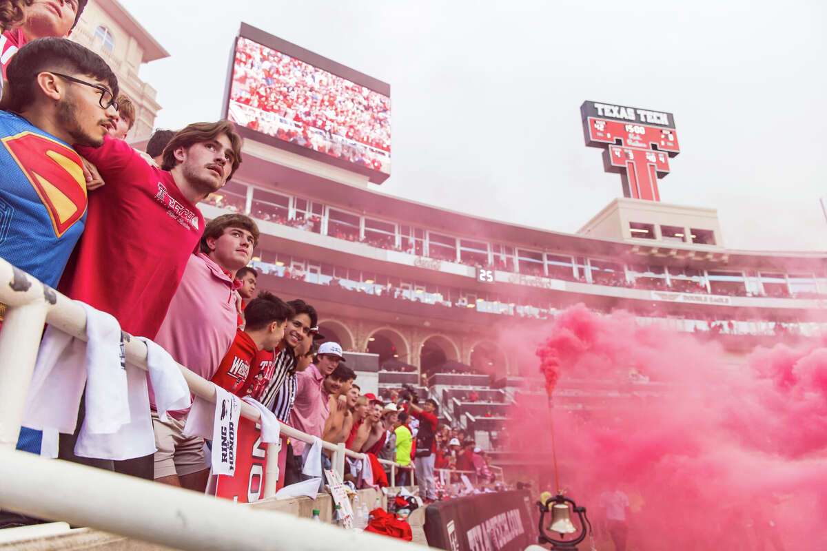Texas Tech and BYU fans have joined forces to help raise money for Ivan Ortiz, the Red Raiders' team barber, who is facing a lot of medical bills after his wife was hit by a drunk driver in October. 