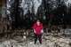 Karin Kaksonen looks through the remains of her home for the first time after the Camp Fire tore through the area on Wee Dell Road in Paradise, Calif.