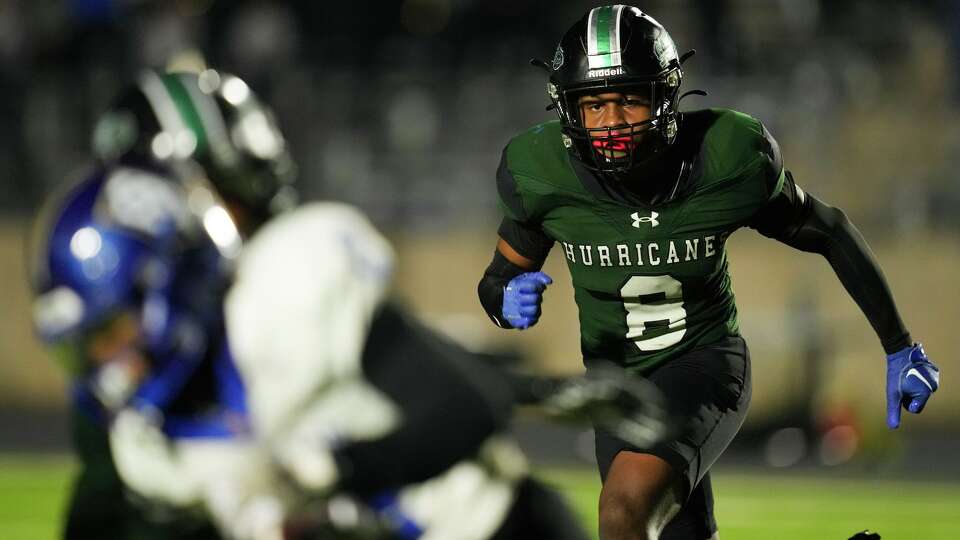 Hightower safety Cornelius Anthony II runs toward Elkins running back Tyson Craft during the second half of a District 21-6A high school football game in Missouri City, Thursday, Nov. 6, 2025.