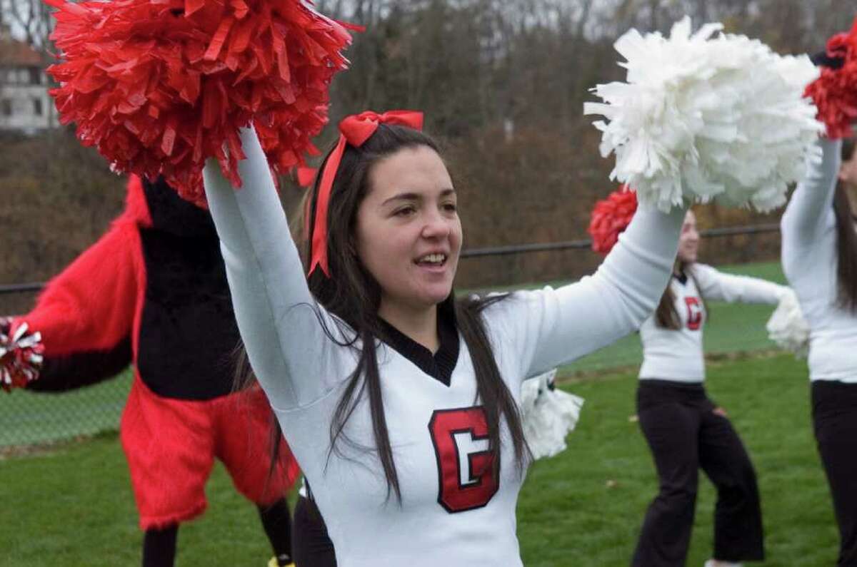 Greenwich High School cheerleader, Maggie Wallace, 17, practicing before the football game between Greenwich High School and Staples High School, hosted by Greenwich, on Thanksgiving, Thursday, Nov. 25, 2010.