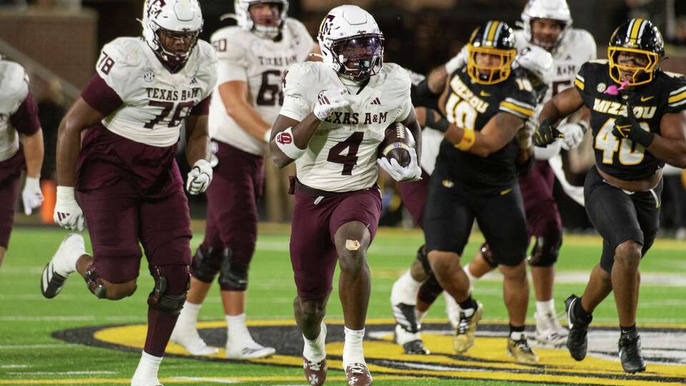 Texas A&M running back Rueben Owens II (4) runs for a touchdown during the second half?Nov. 8, 2025, in Columbia, Mo.?
