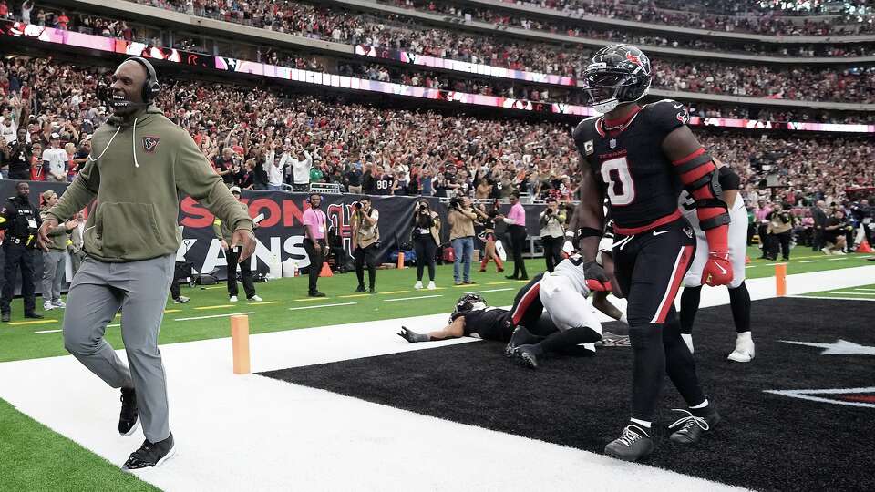 Houston Texans head coach DeMeco Ryans runs to celebrate with his team after a pick six against the Jacksonville Jaguars at NRG Stadium in Houston on Sunday, Nov. 9, 2025. Houston Texans won the game 36-29.