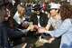A group of friends toast with their beverages at Outside Lands music festival in San Francisco in 2018.
