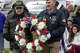 Vietnam Veterans Mike Rogalski, left, and Jerry Augustine, both of Middletown, carry a wreath during a Veterans Day ceremony at Connecticut State Veterans Cemetery in Middletown, Conn., Tuesday, November 11, 2025.