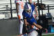 Midland Christian's Payton Ross makes an acrobatic catch while being tackled by Brook Hill's Casper Hansen, Nov. 14, 2025, at Gordon Awtry Field.