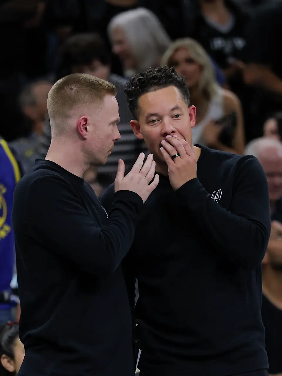 San Antonio Spurs associate coach Sean Sweeney talks to head coach Mitch Johnson during an NBA Cup game at Frost Bank Center in San Antonio, Friday, Nov. 14, 2025. The Spurs fell to the Warriors 109-108.