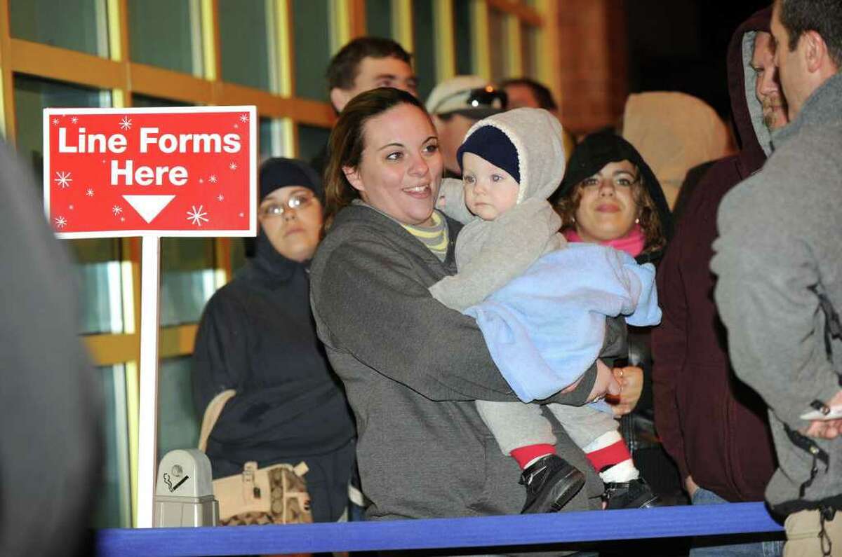 Amanda Williams of New Milford waited in line with her 9 1/2-month-old son Gavin at Toys R Us in Danbury. The store opened at 10 p.m. Thanksgiving night to give shoppers an early start on Black Friday shopping. Photo taken Thursday, Nov. 25, 2010.